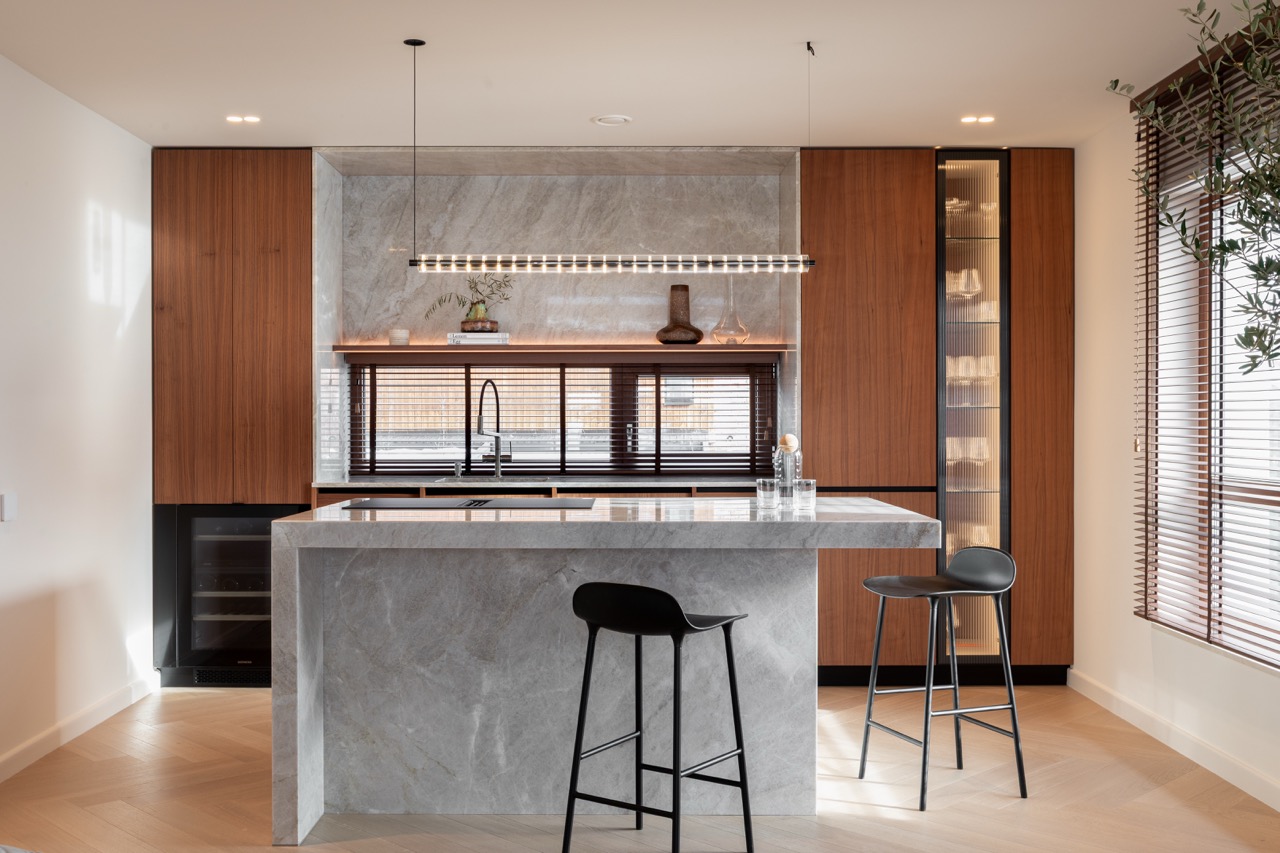 Kitchen with marble island and Miele appliances