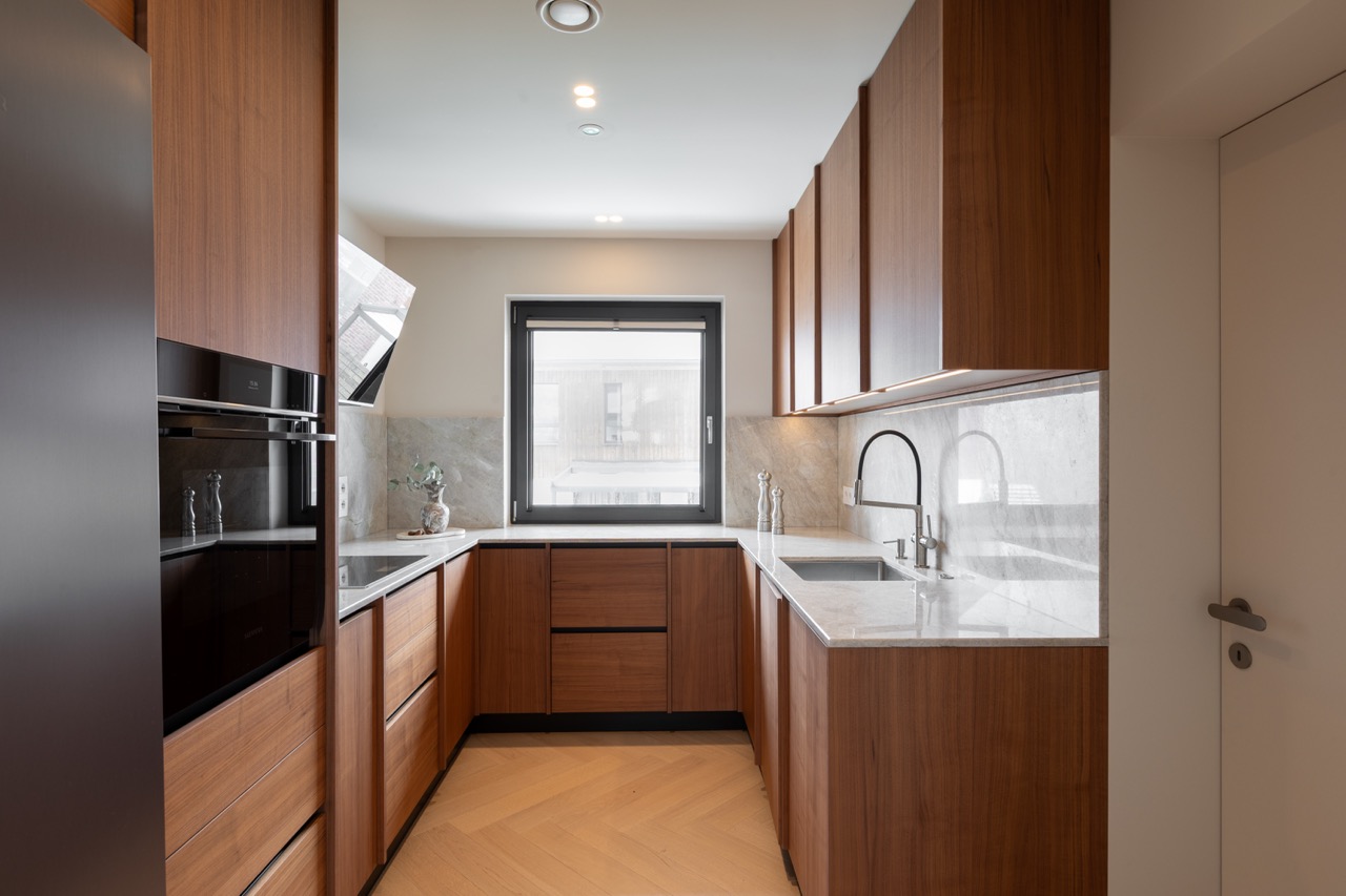 Secondary kitchen with walnut cabinets